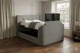 Luxury Grey TV bed with surround sound built in tv lift and soundbar with subwoofer ottoman storage and media tray.